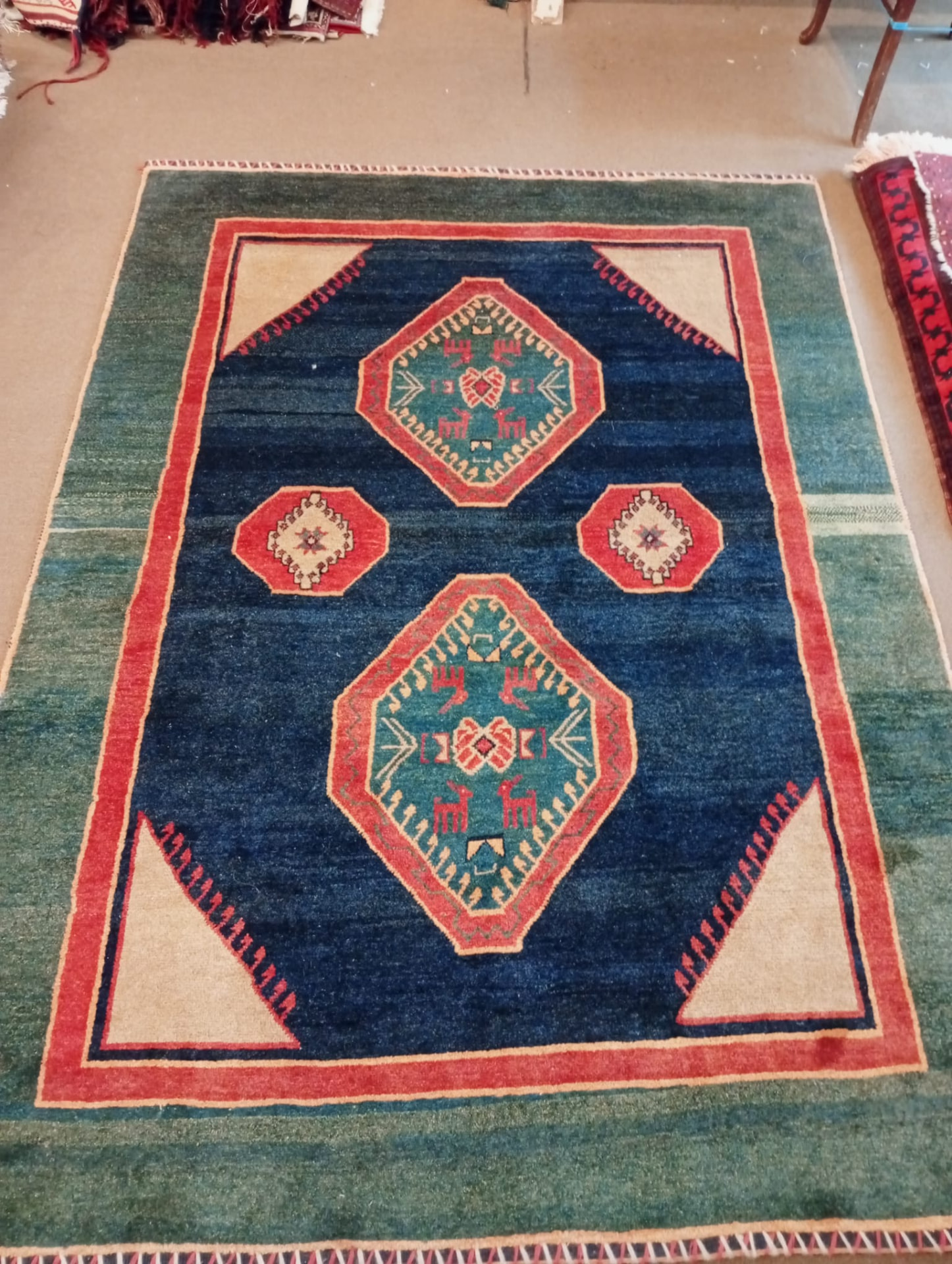 Modern Gabbeh rug with teal and green field and red border