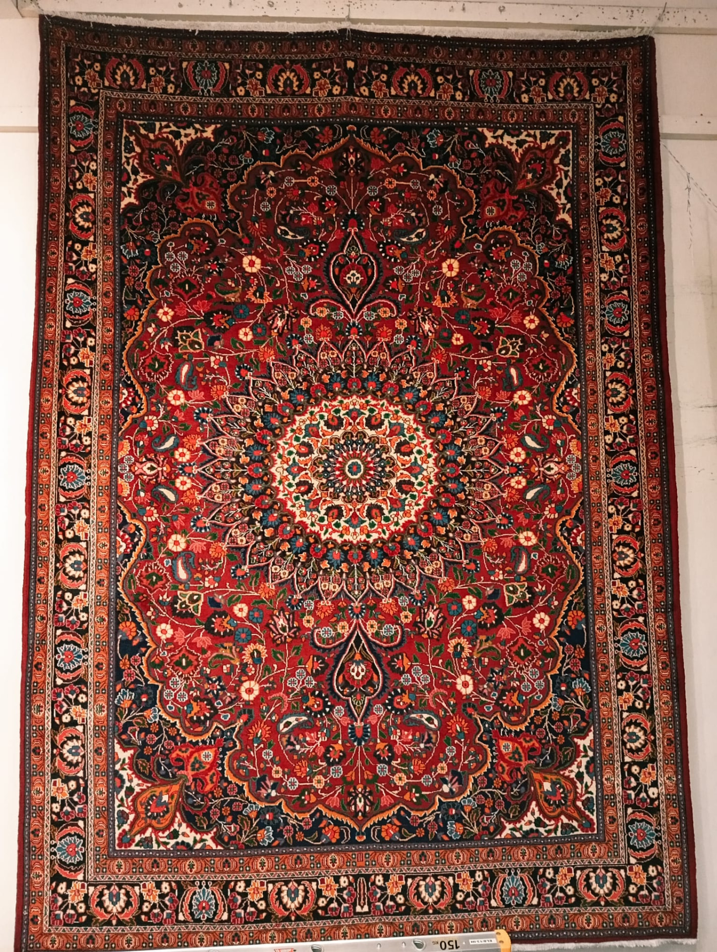 Antique-style Kashan Persian rug with deep red field and ivory medallion